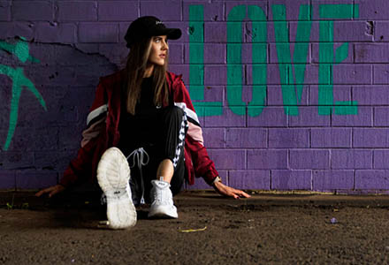 Image of Caoimhe modelling sportwear in an urban setting that links to other sportswear images